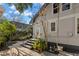 Charming backyard with stone pavers, lush landscaping, and access to the home at 115 21St Ne Ave, St Petersburg, FL 33704