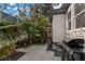 Cozy backyard with lush landscaping and a grill, perfect for outdoor dining and entertaining at 115 21St Ne Ave, St Petersburg, FL 33704