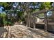 Charming backyard featuring a patio with outdoor seating and mature trees creating a relaxing space at 115 21St Ne Ave, St Petersburg, FL 33704