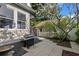Backyard patio with a grill, complemented by mature trees for shade and privacy at 115 21St Ne Ave, St Petersburg, FL 33704
