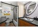 Well-lit bathroom with a sleek vanity, modern fixtures, and classic black and white tile at 115 21St Ne Ave, St Petersburg, FL 33704