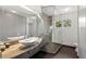 Modern bathroom featuring granite countertops, sleek vessel sink, and glass-enclosed shower with natural light at 115 21St Ne Ave, St Petersburg, FL 33704