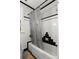 Classic bathroom with black and white tiling and shower and tub featuring a decorative curtain at 115 21St Ne Ave, St Petersburg, FL 33704