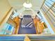 Upstairs bedroom features a plush bed, modern ceiling fan, and natural light at 115 21St Ne Ave, St Petersburg, FL 33704