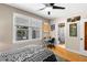 Bedroom with a view to the exterior, with an adjacent bathroom in a home at 115 21St Ne Ave, St Petersburg, FL 33704