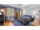 Bedroom with hardwood floors, natural light, and neutral wall paint at 115 21St Ne Ave, St Petersburg, FL 33704