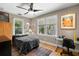 Bright bedroom with a ceiling fan, ample windows, and a dedicated desk area for work or study at 115 21St Ne Ave, St Petersburg, FL 33704