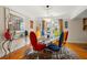 Open dining room with artistic decorations, colorful chairs, and a modern table at 115 21St Ne Ave, St Petersburg, FL 33704