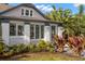 Charming home exterior with tropical landscaping, decorative plants, and updated entryway at 115 21St Ne Ave, St Petersburg, FL 33704
