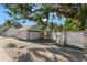 Detached two car garage with a white exterior and blue trim, featuring a gated entrance at 115 21St Ne Ave, St Petersburg, FL 33704