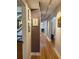 Inviting hallway with hardwood floors and elegant artwork creating a warm and welcoming atmosphere at 115 21St Ne Ave, St Petersburg, FL 33704
