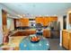Bright kitchen featuring stainless steel appliances, granite countertops, and an island bar at 115 21St Ne Ave, St Petersburg, FL 33704
