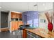 Charming kitchen with granite countertops, stainless steel appliances, and a breakfast bar at 115 21St Ne Ave, St Petersburg, FL 33704