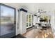 Bright sunroom with ample natural light and a dining table setup; has potential for many uses at 115 21St Ne Ave, St Petersburg, FL 33704