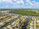 Impressive aerial view showcasing waterfront residences with canal systems and access to open water at 121 Colonial Sw St, Port Charlotte, FL 33952