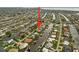 An aerial view with an arrow pointing to a waterfront home with a private dock in a canal community with easy access to the open water at 121 Colonial Sw St, Port Charlotte, FL 33952
