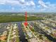 Aerial view focused on canal-front home with a private dock, set in a desirable waterfront community at 121 Colonial Sw St, Port Charlotte, FL 33952