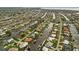 Wide aerial view of a waterfront residential community with canal access and neatly landscaped yards in a coastal Florida neighborhood at 121 Colonial Sw St, Port Charlotte, FL 33952