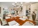 Dining room featuring a wooden table, chairs, decor, and chandelier lighting with a view to the Living Room at 121 Colonial Sw St, Port Charlotte, FL 33952