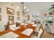 Formal dining room with wood table, chandelier, and elegant decor with access to the patio and pool at 121 Colonial Sw St, Port Charlotte, FL 33952