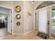 Inviting foyer with decorative wall art and tile flooring at 121 Colonial Sw St, Port Charlotte, FL 33952