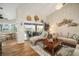 Bright living room with decorative accents, neutral tones, and sliding glass doors leading to the outdoor patio at 121 Colonial Sw St, Port Charlotte, FL 33952