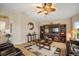 Comfortable living room with a TV and entertainment center, stylish decor, and comfortable leather seating at 121 Colonial Sw St, Port Charlotte, FL 33952