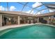 Spacious screened-in pool and patio area, ideal for outdoor entertaining and relaxation at 121 Colonial Sw St, Port Charlotte, FL 33952
