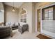 Inviting front porch with a seating area perfect for relaxing and enjoying the outdoors at 121 Colonial Sw St, Port Charlotte, FL 33952