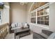 Inviting front porch with a seating area perfect for relaxing and enjoying the outdoors at 121 Colonial Sw St, Port Charlotte, FL 33952