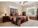 Cozy bedroom with a high ceiling, stained glass and a ceiling fan at 1430 Beaconsfield Dr, Wesley Chapel, FL 33543