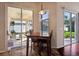 Dining area with sliding glass doors that lead to an outdoor patio at 1430 Beaconsfield Dr, Wesley Chapel, FL 33543
