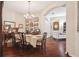 Spacious dining room featuring hardwood floors and direct access to living area at 1430 Beaconsfield Dr, Wesley Chapel, FL 33543