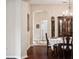 Open dining room with a view into the hallway and a decorative china cabinet at 1430 Beaconsfield Dr, Wesley Chapel, FL 33543