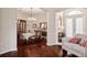 Elegant dining room featuring hardwood floors, chandelier lighting, and a large dining table at 1430 Beaconsfield Dr, Wesley Chapel, FL 33543
