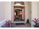 Welcoming home interior view through opened double doors, providing a glimpse into the living space at 1430 Beaconsfield Dr, Wesley Chapel, FL 33543