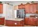 Kitchen island with granite countertops and stainless steel appliances at 1430 Beaconsfield Dr, Wesley Chapel, FL 33543