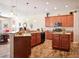 Well-appointed kitchen with central island, granite countertops, and modern appliances at 1430 Beaconsfield Dr, Wesley Chapel, FL 33543