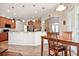 Open kitchen and dining area with hardwood floors at 1430 Beaconsfield Dr, Wesley Chapel, FL 33543