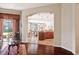 Cozy living room featuring hardwood floors and an open layout with views of kitchen and dining areas at 1430 Beaconsfield Dr, Wesley Chapel, FL 33543