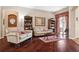 Cozy living room features hardwood floors, comfortable seating, and tasteful decor at 1430 Beaconsfield Dr, Wesley Chapel, FL 33543