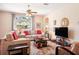 Cozy living room features hardwood floors and comfortable seating at 1430 Beaconsfield Dr, Wesley Chapel, FL 33543