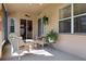 Screened-in patio features comfortable wicker furniture, ceiling fan, and serene outdoor views at 1430 Beaconsfield Dr, Wesley Chapel, FL 33543