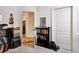 Room features a bookcase and hallway with wood floors at 1430 Beaconsfield Dr, Wesley Chapel, FL 33543