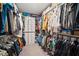 Spacious walk-in closet featuring ample shelving and hanging storage for clothing and accessories at 1547 Golden Glow Dr, Ruskin, FL 33570