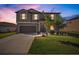 Beautiful two-story home featuring manicured lawn and a two-car garage, perfect for a growing Gathering at 1547 Golden Glow Dr, Ruskin, FL 33570