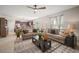 Open-concept living room flowing into kitchen and dining area, perfect for entertaining guests at 1547 Golden Glow Dr, Ruskin, FL 33570