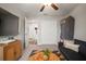 Cozy living room boasts a large television, closet, and comfortable futon at 1547 Golden Glow Dr, Ruskin, FL 33570