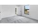 Neutrally decorated bedroom featuring a large window for plenty of natural light at 1721 Shevlin St, North Port, FL 34286