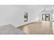 Bright living area featuring vaulted ceilings, wood-look flooring, and a view of the backyard at 1721 Shevlin St, North Port, FL 34286